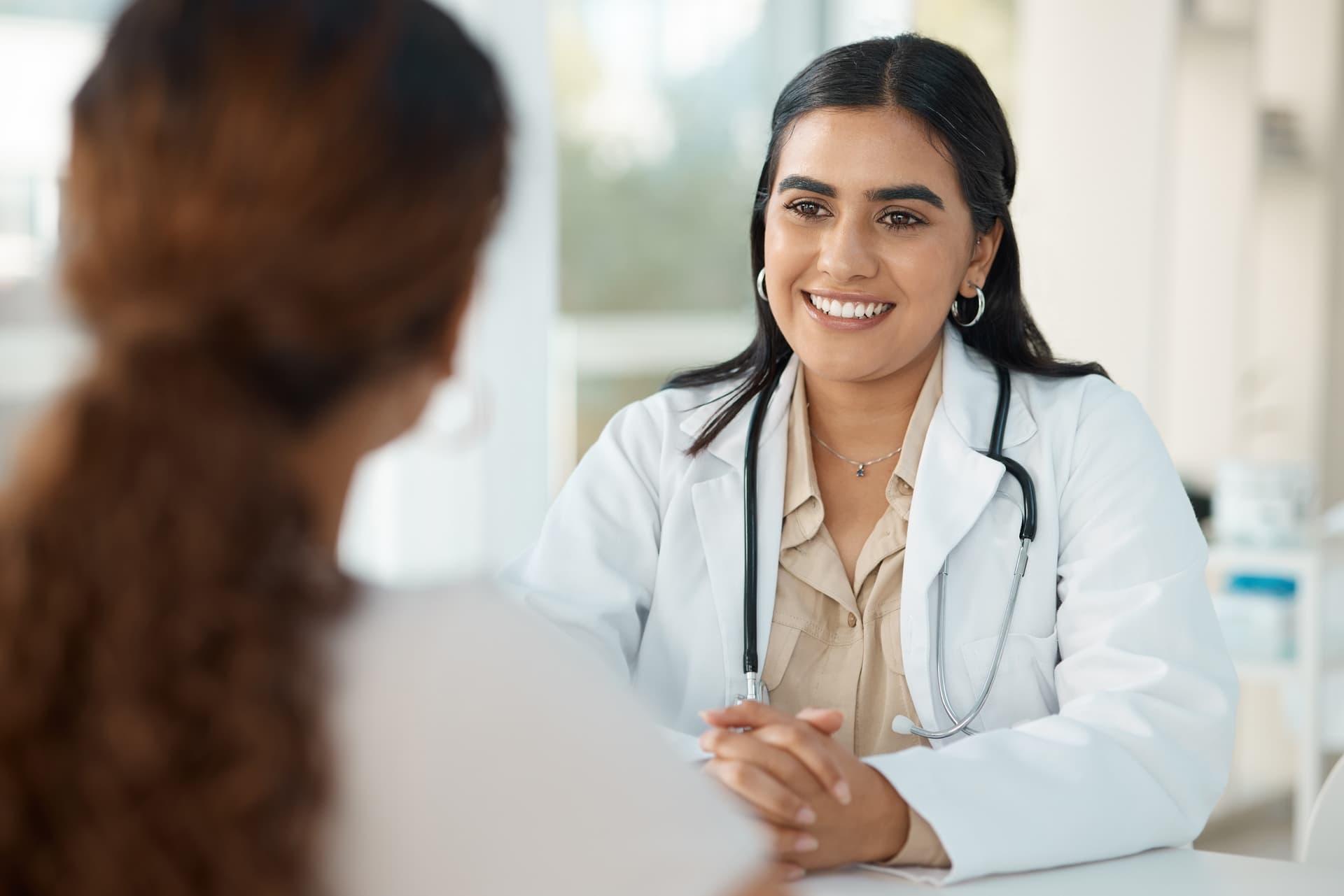 Healthcare professional consulting with patient